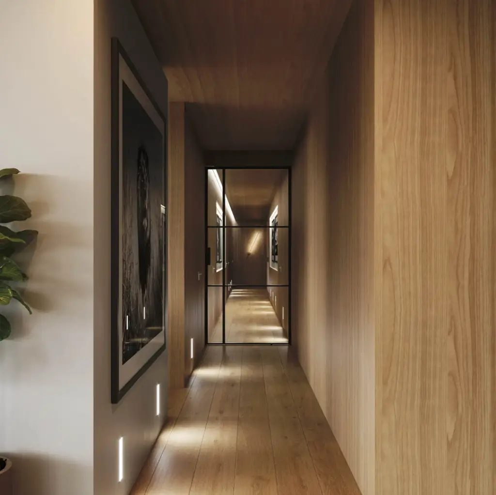 Minimalist hallway with warm wood paneling, integrated floor lighting, and a glass-paneled door creating depth and modern architectural symmetry.
